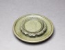 Greenware cup stand with boy holding a tea-cup (oblique)