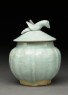 Lidded white ware jar surmounted by bird (side)