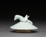 Lidded white ware jar surmounted by bird (side)