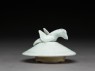 Lidded white ware jar surmounted by bird (side)