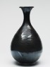 Black ware bottle with floral decoration (side)