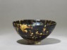 Black ware tea bowl with 'tortoiseshell' glazes (oblique)