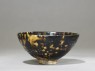 Black ware tea bowl with 'tortoiseshell' glazes (oblique)