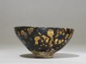 Black ware tea bowl with 'tortoiseshell' glazes (side)