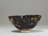 Black ware tea bowl with 'tortoiseshell' glazes (side)