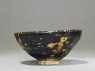 Black ware tea bowl with 'tortoiseshell' glazes (side)