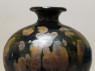 Black ware vase with 'partridge feather' glazes (detail, upper part)