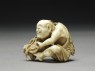 Netsuke in the form of a man making a mat (side)