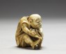 Netsuke in the form of a man making a mat (side)