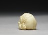 Netsuke in the form of a wild boar among grass (side)