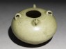 Greenware jar with chicken head and tail (oblique)