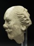 Stucco head of a man (side)