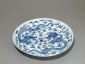 Blue-and-white dish with dragons chasing a flaming pearl (oblique)