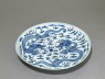 Blue-and-white dish with dragons chasing a flaming pearl (oblique)