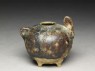 Brown glazed rabbit lime-pot (oblique)