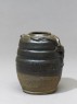 Dark brown glazed dragon jar (oblique)