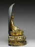 Figure of the Buddha with a mandorla, or halo, seated on a lotus pedestal (side)