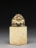 Soapstone seal surmounted by six-legged toad (side)