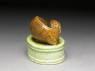 Porcelain seal surmounted by a deer (oblique)