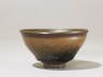 Black ware tea bowl with 'hare's fur' glaze (side)