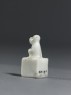 Porcelain seal surmounted by a seated animal (side)