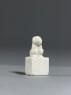 Porcelain seal surmounted by a seated animal (side)