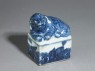 Blue-and-white seal surmounted by a shishi, or lion dog (oblique)