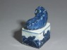 Blue-and-white seal surmounted by a shishi, or lion dog (oblique)