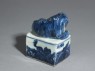 Blue-and-white seal surmounted by a shishi, or lion dog (oblique)