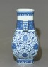 Blue-and-white vase with fruit and leaves (oblique)