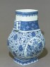 Blue-and-white vase with fruit and leaves (oblique)