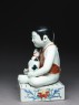 Figure of a boy seated on a shogi, or chess board (side)