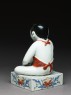 Figure of a boy seated on a shogi, or chess board (side)