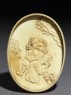 Ivory box with figure holding a fan (inside, lid)