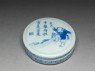 Blue-and-white box with a boy on a hill (oblique)