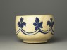 Mortar-shaped bowl with vegetal decoration (side)