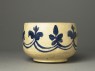 Mortar-shaped bowl with vegetal decoration (side)