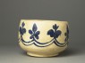 Mortar-shaped bowl with vegetal decoration (side)