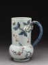 Tankard with modelled flowers and leaves (oblique)