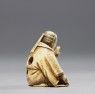 Netsuke in the form of a Nō actor wearing a mask (side)