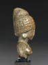 Female figure with a tall headress (side)