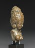 Female figure with a tall headress (side)