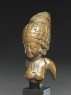 Female figure with a tall headress (side)