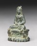 Figure of Tara seated on lion throne (side)