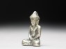 Silver amulet in the form of the Buddha (side)