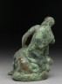 Figure of the hero god Heracles with his club seated on a lion (side)