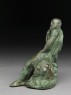 Figure of the hero god Heracles with his club seated on a lion (side)