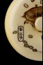 Manjū netsuke depicting Daikoku scattering coins for Ebisu (detail)