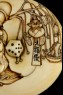 Manjū netsuke depicting Fukurokuju, one of the Seven Lucky Gods, carrying toys on a willow branch (detail)