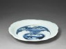 Dish with mandarin ducks amid waves (oblique)